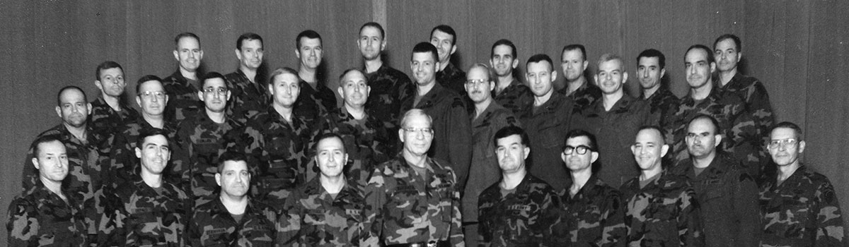 MG Leroy N. Suddath, Jr., the Commanding General, 1st SOCOM, is pictured here with his staff (circa 1985). MG Suddath, Jr. is in the front row, fifth from the left. To his immediate right is his Command Sergeant Major, Steven P. Holmstock.
