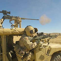 Special Forces soldiers engage targets from a ground mobility vehicle during Operation IRAQI FREEDOM, 2004.
