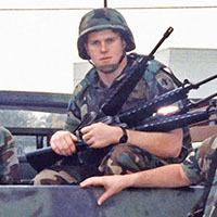 (L-R) SFC James Boone, Sergeant (SGT), Stephen R. Anderson, and CPT Mark A. Olinger with their M1008 Commercial Utility Cargo Vehicle (CUCV). SGT Anderson (center) shows off captured Panamanian M-16 rifles that had been cached by forces loyal to General Manuel Noriega. Notice the markings on the tailgate of the CUCV. 