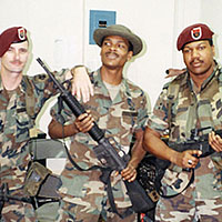 (L-R): Sergeant (SGT) William D. Childs, Staff Sergeant (SSG) Henry N. McCrae, and SGT Darell A. Brown pose in the SOCSOUTH radio room at Albrook Air Station in January 1990. All three were seasoned Special Operations Communications Assemblage (SOCA) operators, having multiple deployments to their credit. JUST CAUSE provided them their first combat deployment. (Photo Courtesy of William D. Childs)