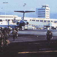 Soldiers move to their assigned locations at the airport, just after sunrise on 20 December 1989.