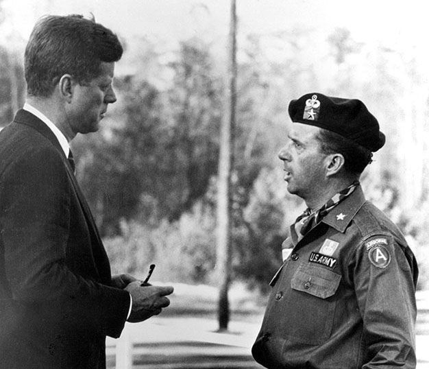 Brigadier General (BG) William P. Yarborough talked with President Kennedy following the 12 October 1961 special warfare demonstration at McKellar’s Pond. 