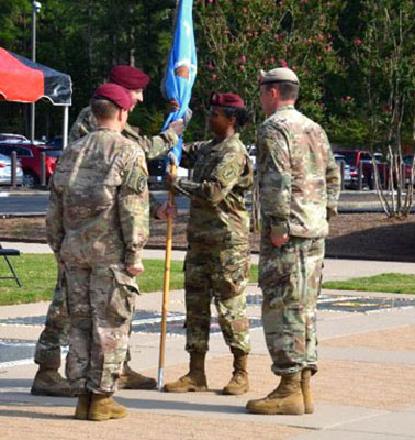 Lieutenant Colonel Sapriya Childs takes the battalion colors from Colonel John B. Hinson, 528th Sustainment Brigade Commander, during the battalion’s 28 August 2018 Change of Command ceremony.