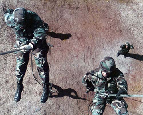CPT Steve Kestner and another unidentified Company A, 112th Signal Battalion soldier conduct rappel training at Fort Bragg, NC (circa 1989-90).