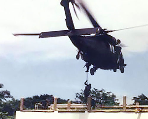 The 617th SOAD and Company C, 3-7th SFG demonstrate fast roping and insertion onto a multi-story building during the early-1990s. The units trained the same tactics in preparation for Operation JUST CAUSE.