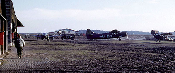 Bad Tölz Army Airfield with U-1A Otter and O-1  Bird Dog aircraft parked on WWII-era perforated steel planking (PSP) in 1958