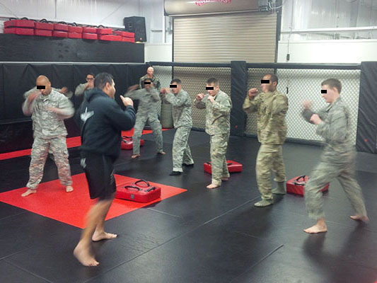 A contractor teaches striking techniques during the Combatives phase of the Combat Skills course.