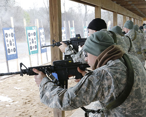 Under the watchful eye of a ‘Black Shirt’ instructor, students conduct advanced weapons training during Combat Skills.  