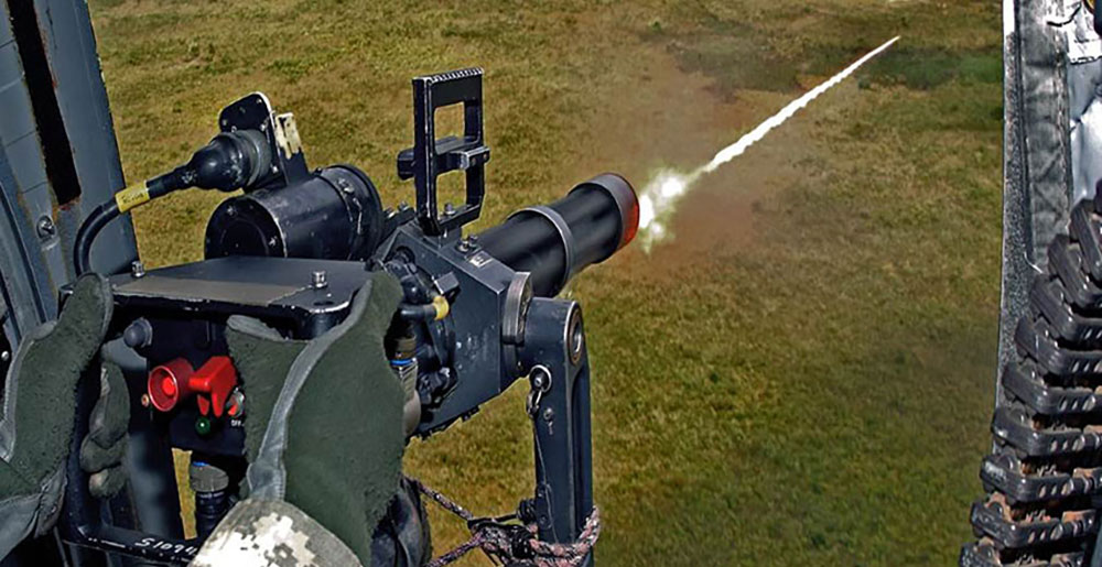 A crew chief fires his mini-gun during aerial gunnery training.  In Fiscal Year 2014 alone, SOATB ran 83 aerial gunnery ranges and expended 3.5 million rounds of 7.62 mm ammunition and 1,158 rockets.  