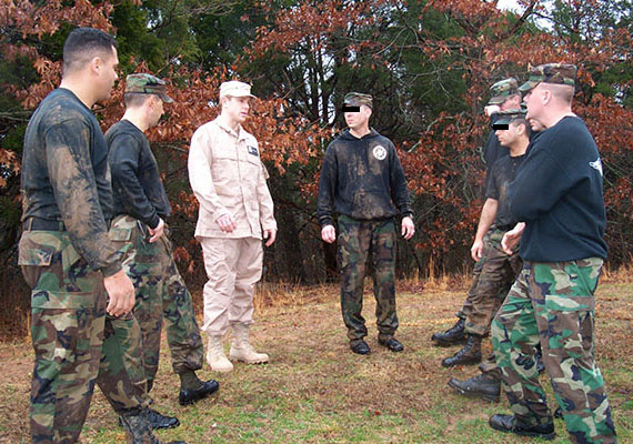 Actor Ron J. Eldard (third from left) consults with Special Operations Aviation Training Company (SOATC) cadre.  Eldard visited the 160th SOAR for his upcoming role as UH-60 pilot CW3 Michael Durant in the 2001 film Black Hawk Down about the Battle of Mogadishu, Somalia, in October 1993.  