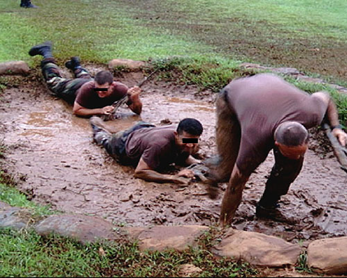 Night Stalker candidates negotiate many obstacles, including mud pits, during the team-building portion of Combat Skills. 