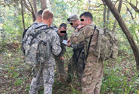 160th SOAR aviator candidates use a protractor to plot their points during the Land Navigation phase of Combat Skills, Company A, SOATB. 