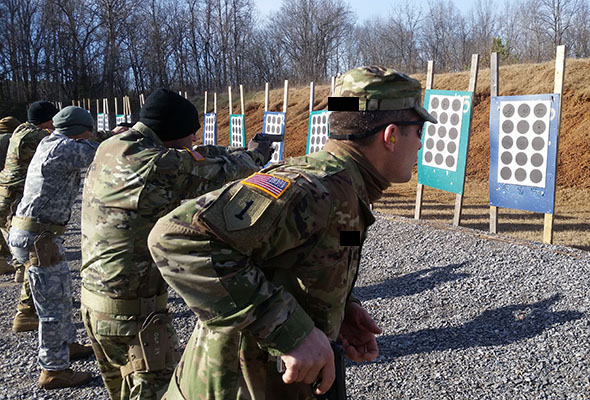Officers fire 9mm pistols during Combat Skills weapons training, Company A, SOATB. 