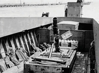 A chemical 4.2 inch mortar mounted in an Landing Craft Mechanized (LCM 3) to smoke screen an assault landing at Camp Gordon Johnston.