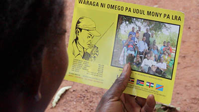 An LRA escapee, Germaine reads a leaflet similar to the one that inspired her to flee.