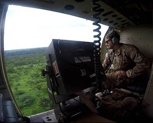 A 7th POB soldier conducts a low-altitude aerial loudspeaker mission during Operation OBSERVANT COMPASS, a common practice after 2013.