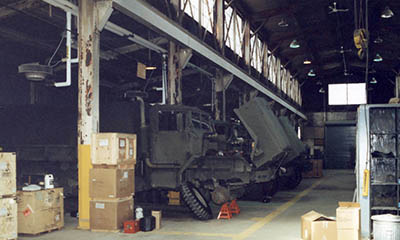 A M923 5-ton cargo truck undergoes routine maintenance inside the Maintenance Detachment shop, located near the XVIII Airborne Corps headquarters.