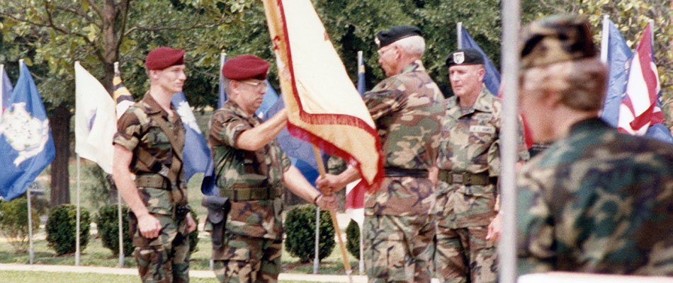 MG Leroy N. Suddath, Jr. hands LTC Louis G. Mason the 13th Support Battalion colors at the battalion activation ceremony, 2 June 1986.