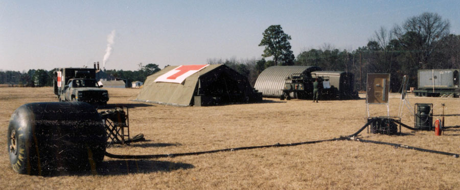 In 1987, the 13th Support Battalion displayed its equipment for BG Wayne A. Downing (DCG, 1st SOCOM). Here, Forward Area Refueling Equipment (FARE) can be seen in the foreground, in front of an ambulance, medical tent, and mobile field kitchen.