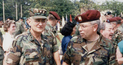 MG Eugene L. Stillions, Jr. (L), Commandant of U.S. Army Quartermaster School, was an early supporter of the SOSB. He is pictured here with LTC Mason (R), at the 13th Support Battalion activation ceremony on 2 June 1986.