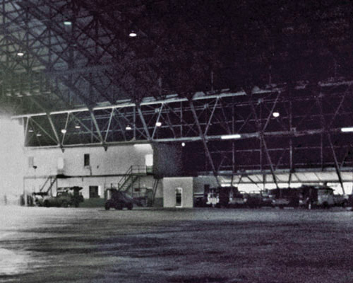 This view shows some of the vehicles that were parked in the hangar. MAJ Cheek directed their removal so he had space to create a DC shelter.