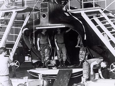 The rear pylon being removed from one of the two Chinooks. The maintenance crew had to ensure that each removed item, to include nuts and bolts, stayed with the airframe.
