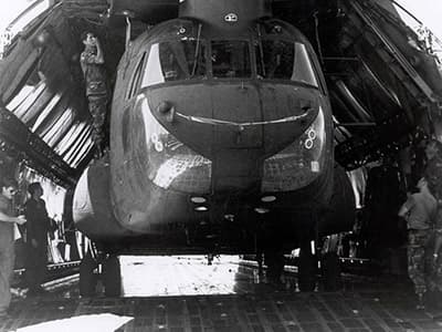 This photo demonstrates the tight fit for each MH-47D in the C-50. The front and rear pylons had to be removed to provide enough clearance.