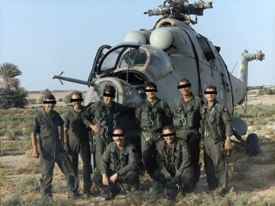 MAJ Hasselbach’s (third from left, standing) crew in front of the Hind at Faya Largeau. A refueling delay allowed them to check out the Soviet helicopter.