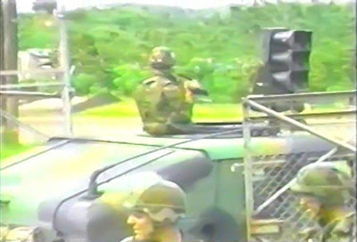 A PSYOP soldier prepares to broadcast information to Panamanian civilians.