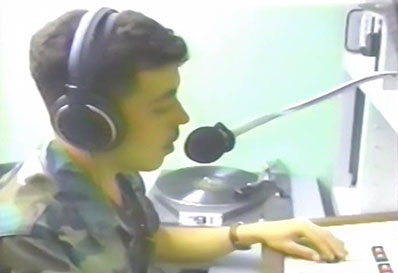 A soldier makes a radio broadcast from Corozal.