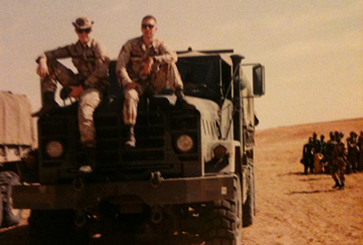 Transportation Company soldiers perch on the hood of a M923 5-ton truck during a rare moment of downtime. The 528th’s truck drivers logged over a quarter million miles in support of ARSOF missions during DESERT SHIELD and DESERT STORM.