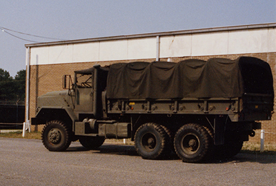 The M923 5-ton cargo truck, seen here in garrison, was the workhorse of the 528th SOSB Transportation Company during Operations DESERT SHIELD and DESERT STORM, and performed superbly in the harsh desert conditions.