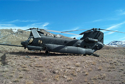 The other side of 476 displayed much more of the damage that crippled the helicopter.  Notice the impact damage to the front, below the window just to the rear of the cockpit.