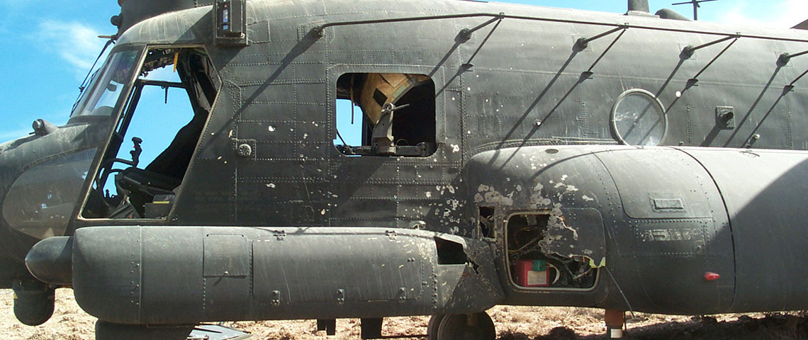 A close up view of the damage to the front of 476. The RPG had exploded on the outside of the helicopter, and started a fire that affected the electrical system.