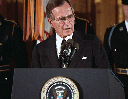George H.W. Bush, Commander-in-Chief during successful military actions in Panama and the Middle East in his short time in office, speaks at the White House in early 1991.