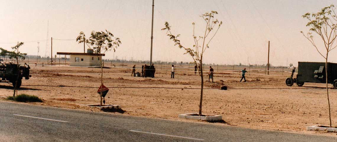 The 125-foot antenna and transmitter shelter (right) for the TAMT-10 at Al Qaisumah, Saudi Arabia, December 1990.