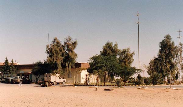 The 40-foot FM (left) and TV (right) antennas for the PAMDIS at Al Qaisumah, Saudi Arabia, December 1990. Although the modular PAMDIS had AM broadcasting capability, it was not needed because the TAMT-10 was collocated with it at the site. Between that and the lack of a TV mission, only its FM capability was utilized.