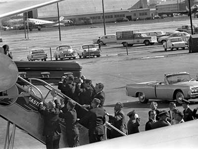 JFK's casket is loaded onto Air Force One at Love Field, for transport back to the capital.
