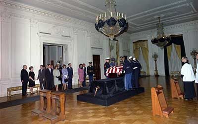 JFK's casket arrives at the East Room of the White House in the early morning hours of Saturday, 23 November 1963. 
