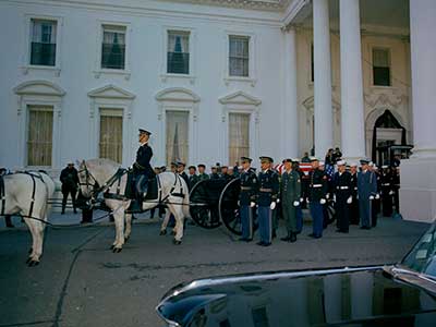 SF soldiers accompany the caisson during the two-mile procession from the White House to the Capitol Building in the early afternoon of Sunday, 24 November.