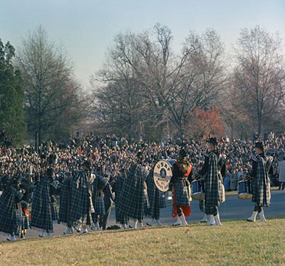 A USAF bagpipe band marches shortly after the arrival of the procession at Arlington and playing of the National Anthem.