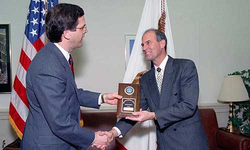 Assistant Secretary of Defense Pete Williams, presents an award to Philip M. Strub, in recognition of his outstanding work in support of the Office of the Assistant Secretary of Defense for Public Affairs, 15 January 1993.