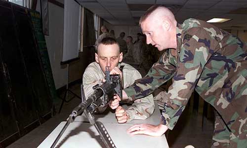 Bremner receives training on machine gun operations. Other weapons introduced included the M16 rifle and Mk 19 automatic grenade launcher.