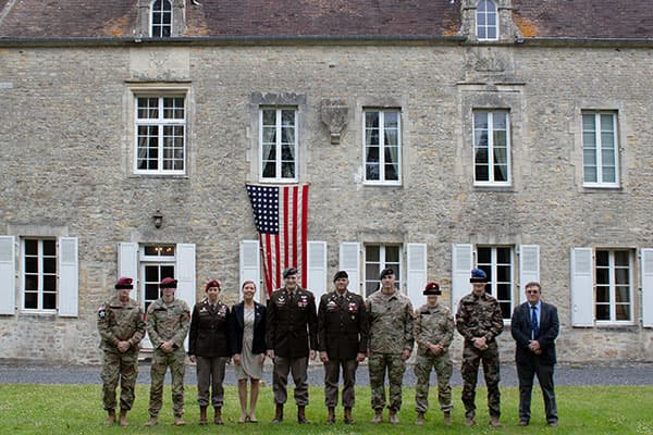 The USASOC Command Team poses outside the Manoir de l'Ormel during their visit to Normandy