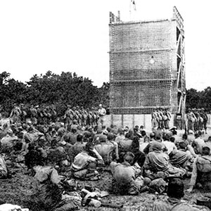 ‘Dry’ cargo net training on the Camp Edwards towers prepared soldiers to climb down from troop transports to landing craft and get back aboard the ship if weather prevented landings.