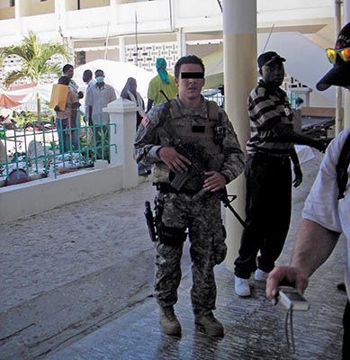 CAT 812 wore full kit when it arrived in Haiti, as does SSG Gasperich. 