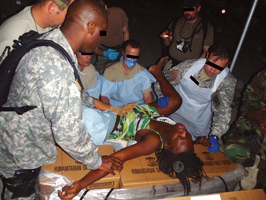 Civil Affairs medics at the U.S. Embassy helping to deliver a baby.