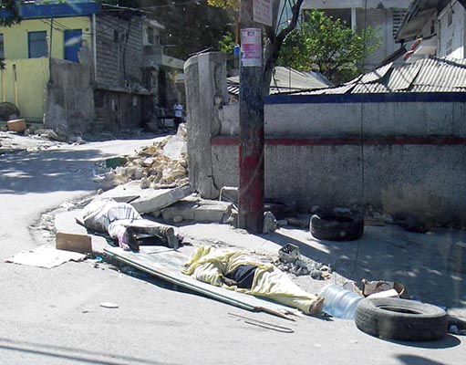 Dead lay on the sidewalks of Port-au-Prince