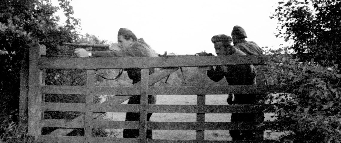 BARDSEA personnel, likely the OSS contingent, practice with their weapons in the field. The soldier on the left uses an OSS-issue 9mm United Defense M42 while the one on the right has a 30.06 Browning Automatic Rifle (BAR).