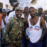 PSYOP soldier poses with a Haitian